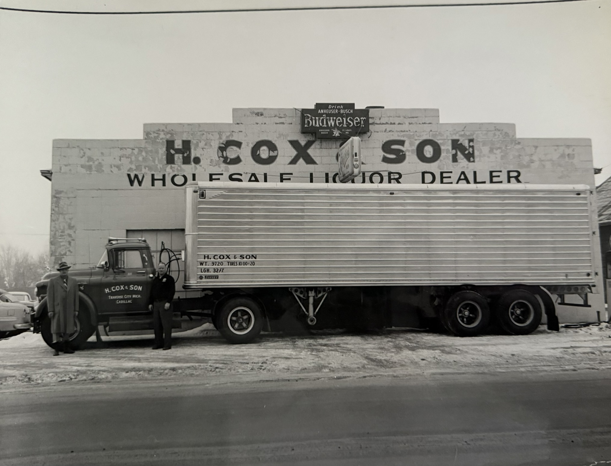 Early H. Cox & Son delivery truck outside the warehouse