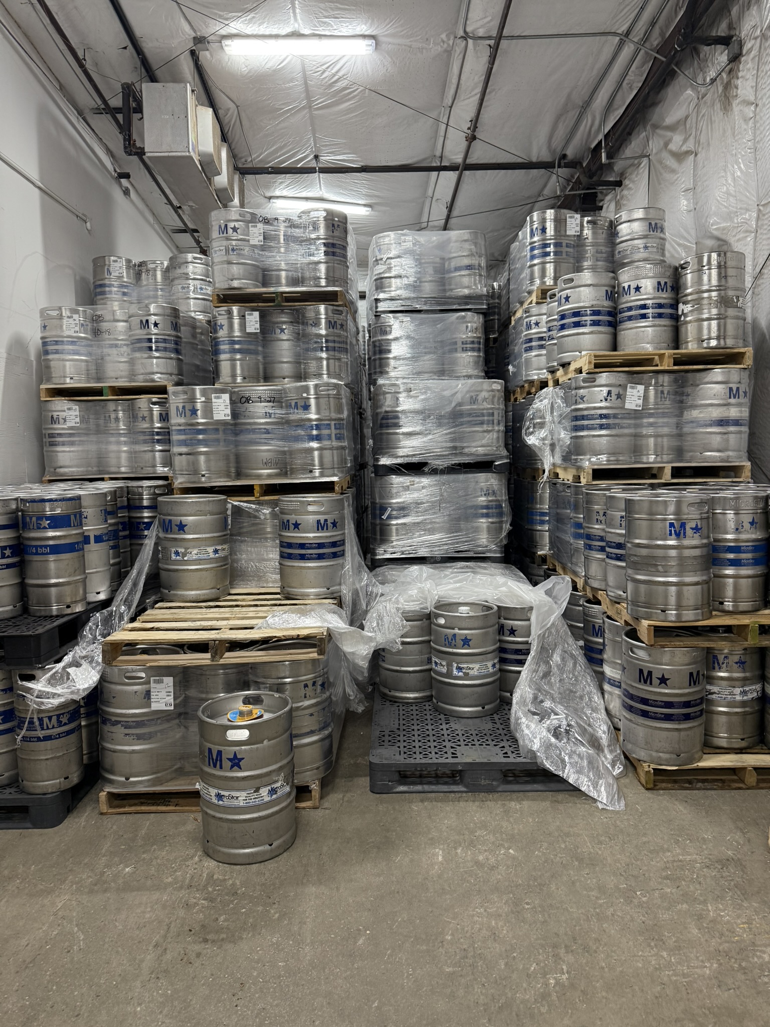 Walk-in cooler stocked with kegs